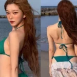 Billlie Tsuki wearing an emerald bikini and long skirt on Awaji Island beach