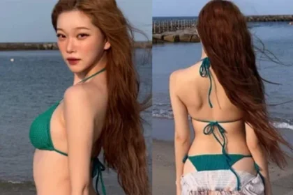 Billlie Tsuki wearing an emerald bikini and long skirt on Awaji Island beach