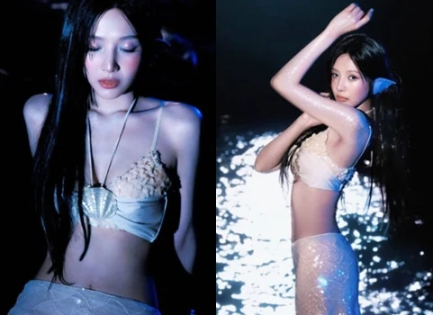 Red Velvet Joy wearing a seashell top and mermaid ear accessories under blue light for Velvet Summer teaser