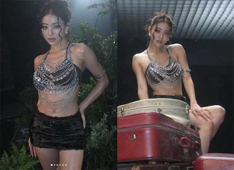 TWICE Jihyo posing in a sparkling silver chain halterneck top and fur mini skirt backstage