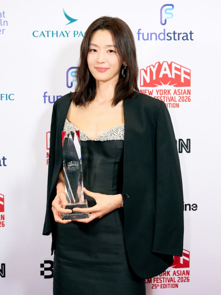 Actress Jun Ji-hyun holding her Extraordinary Star Asia Award at the 25th New York Asian Film Festival gala