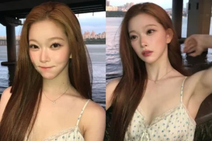 Billie Tsuki wearing a blue floral pattern slip dress next to the Han River sunset