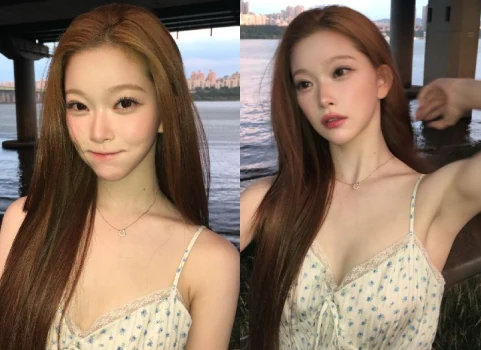Billie Tsuki wearing a blue floral pattern slip dress next to the Han River sunset
