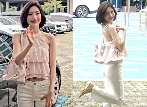 Red Velvet Joy wearing a white halter neck crop top and white pants showcasing her slim waist line
