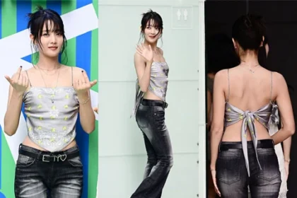 i-dle Minnie wearing a vintage scarf top and black bootcut denim pants