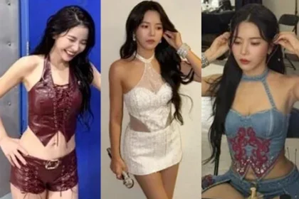MAMAMOO Solar wearing a burgundy leather halter neck top and hot shorts backstage
