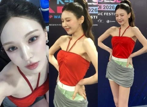 Red Velvet member Wendy posing backstage at K-Pulse Hanoi in a red halterneck top and gray skirt.