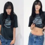 aespa Giselle rolling up a gray t shirt to show clear abs and toned waist for a sportswear photoshoot