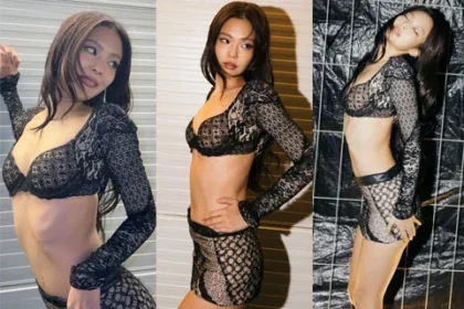 BLACKPINK Jennie posing in a bra top and short skirt stage outfit at Roskilde Festival