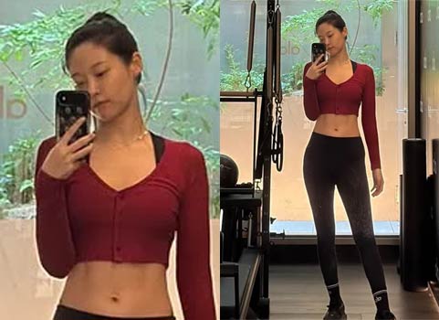 Former AOA member Seolhyun showing off her six-line abs in a bra top and leggings at the gym