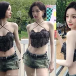 (i-dle) Yuqi performing in a black halter-top bustier at Lollapalooza Chicago