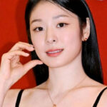 Kim Yuna posing in a black lace dress at a Lotte Avenuel beauty event in Seoul