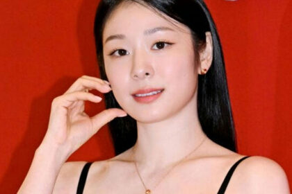 Kim Yuna posing in a black lace dress at a Lotte Avenuel beauty event in Seoul