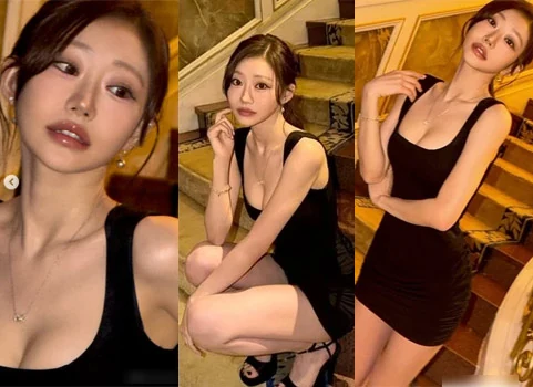 KISS OF LIFE Julie wearing a tight black sleeveless mini dress on stairs