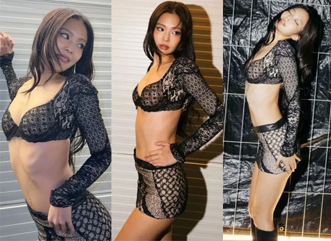 BLACKPINK Jennie posing in a bra top and short skirt stage outfit at Roskilde Festival