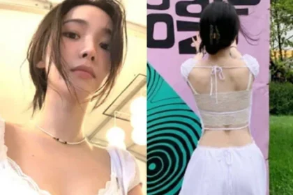 aespa Karina wearing a backless white dress while enjoying a music festival