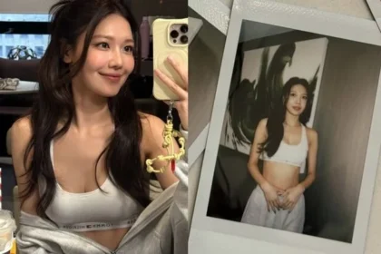 Girls' Generation Sooyoung showing her abs in a white tank top at Tommy Hilfiger fashion show