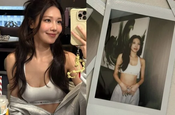 Girls' Generation Sooyoung showing her abs in a white tank top at Tommy Hilfiger fashion show