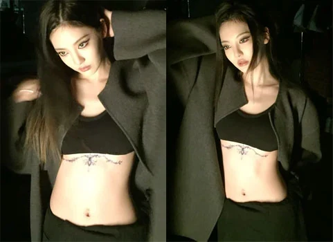 BLACKPINK member Jisoo posing at an amusement park showing off her doll-like visuals