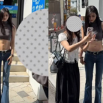 Zi Lang, Chinese model with toned abs, posing on a street in South Korea
