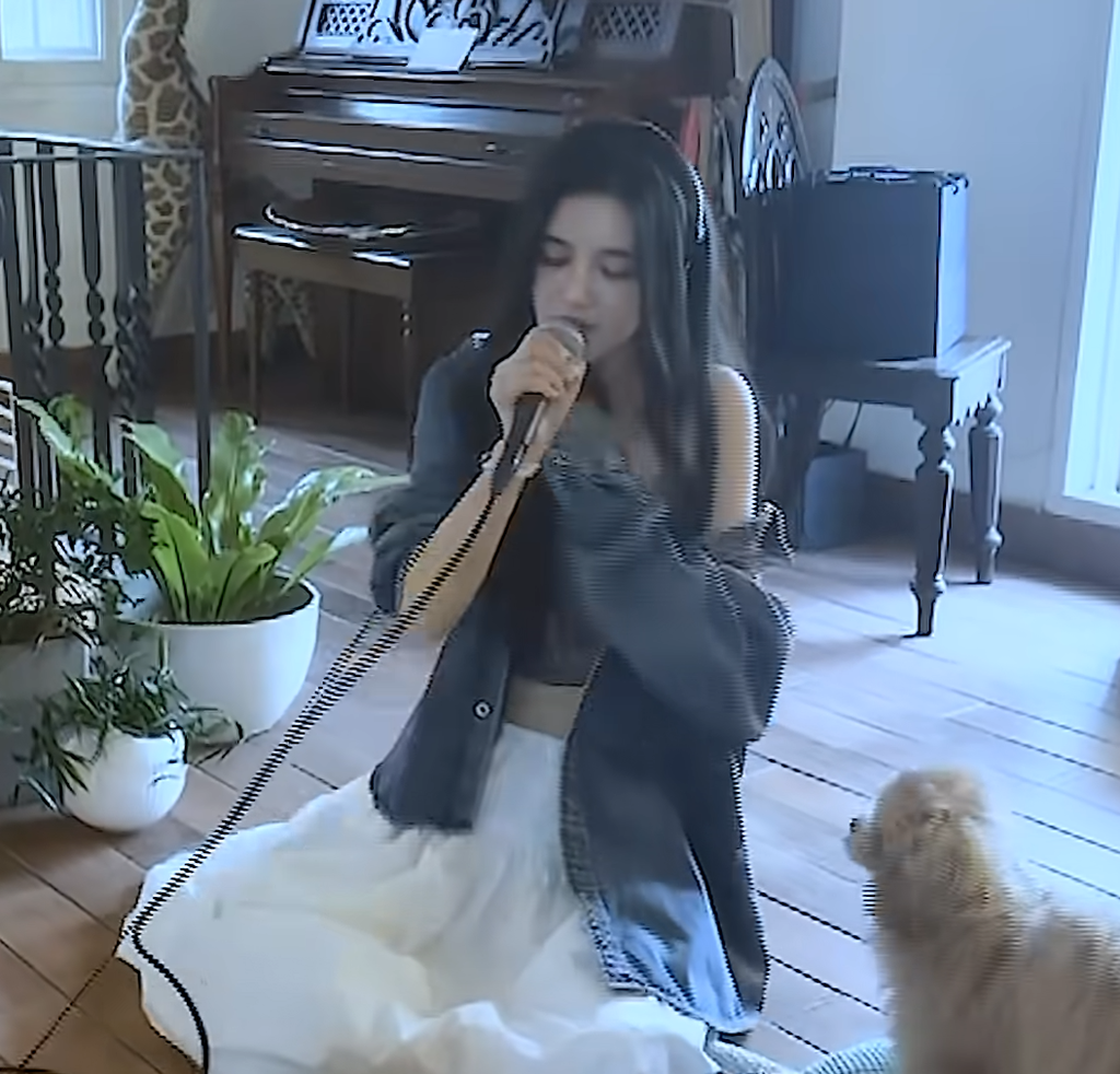 Former NewJeans member Danielle singing her self-composed track Stay in YouTube video