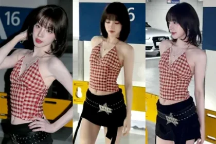 I-DLE Yuqi posing in a red and white gingham halterneck top and low-rise pants in a parking lot