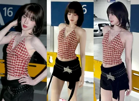 I-DLE Yuqi posing in a red and white gingham halterneck top and low-rise pants in a parking lot