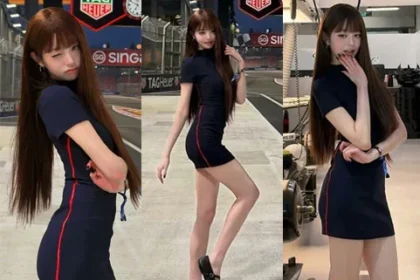 IVE Jang Wonyoung posing in a navy Tommy Hilfiger dress at Singapore race track